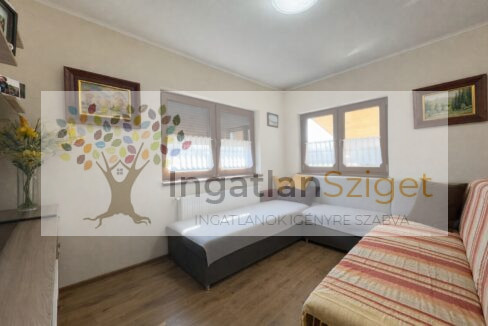 a_digital_photograph_shows_a_tidy_living_room_duri